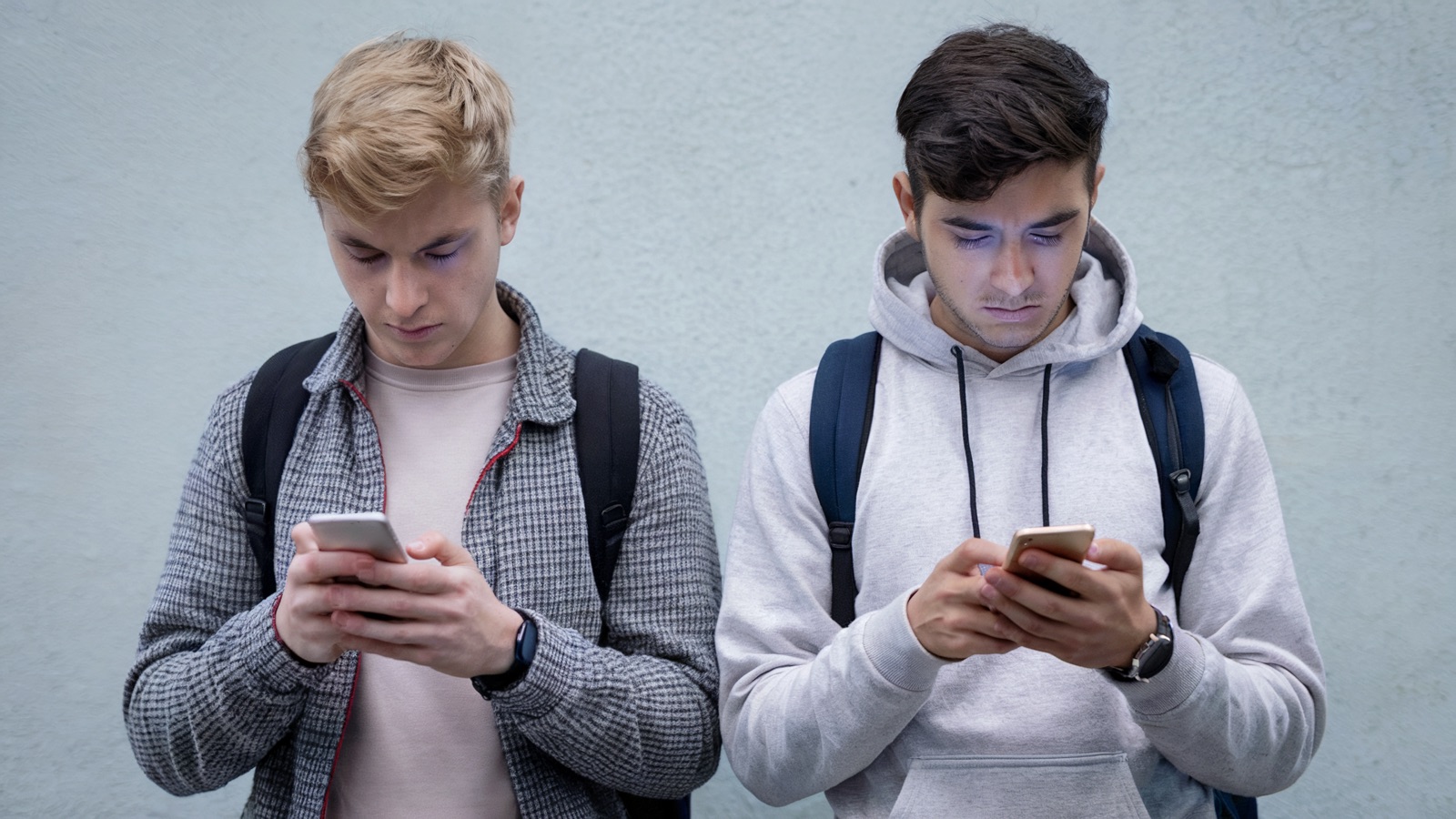 Bored students looking at phones