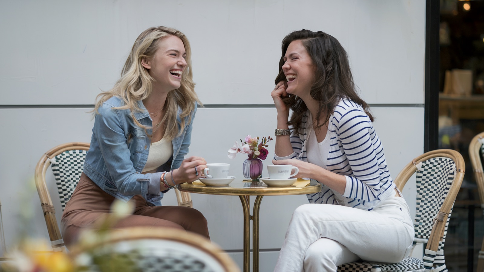 Friends laughing at a tea party